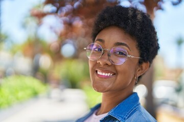 African american woman smiling confident standing at park