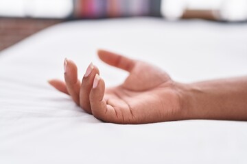 Naklejka premium African american woman lying on bed sleeping at bedroom