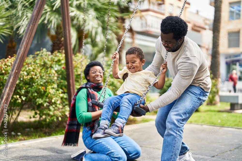 Poster African american family playing on swing at playground