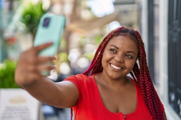 African american woman smiling confident making selfie by the smartphone at street