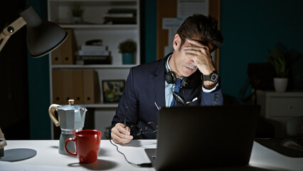 Young hispanic man business worker working stressed at the office