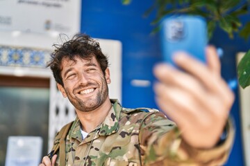 Young man army soldier make selfie by smartphone at street