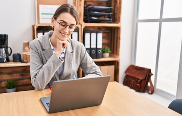 Young caucasian woman business worker using laptop working at office