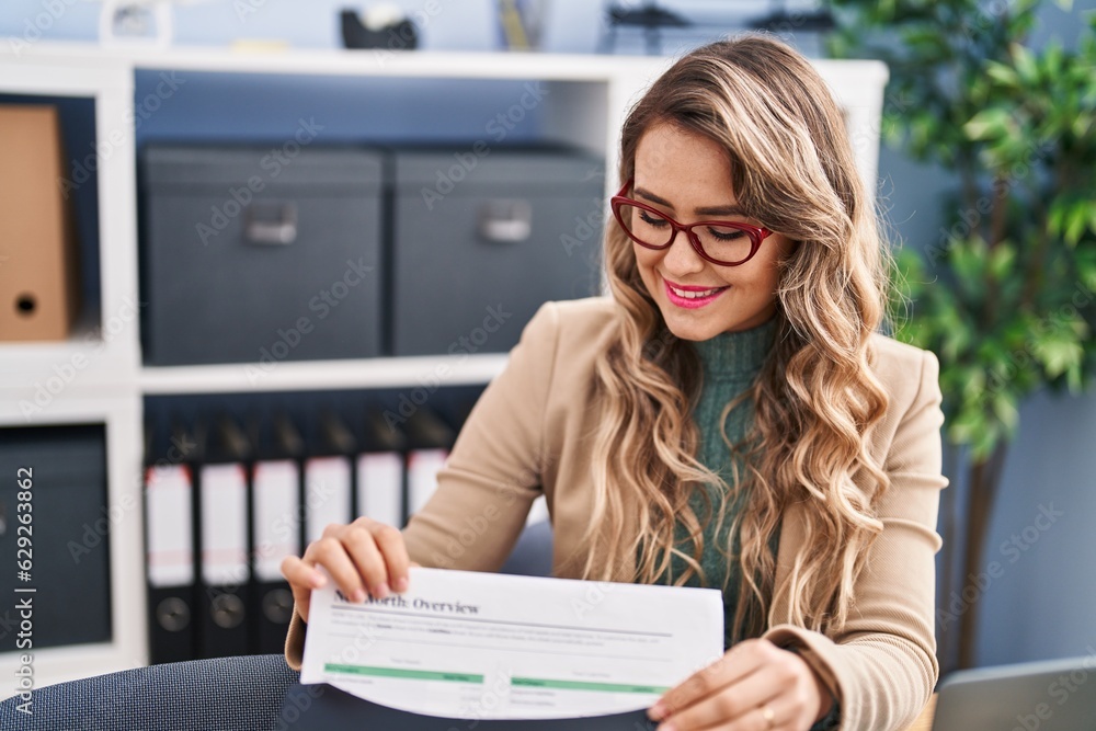 Sticker Young woman business worker holding document on folder at office