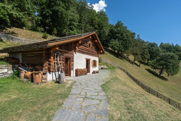 Scenic view of a wooden hut on a green hill at Heidi's Village