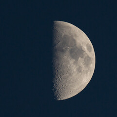 Stunning view of the half moon against a dark night sky.