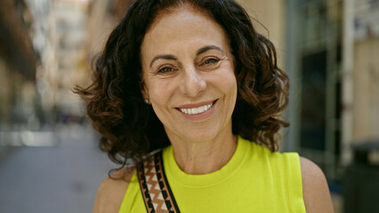 Middle age hispanic woman smiling confident at the street © Krakenimages.com