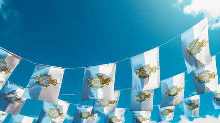 Flag of San Marino against the sky, flags hanging vertically