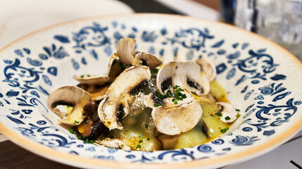  Plate of mushrooms on wooden surface
