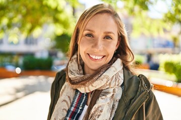 Fototapeta premium Young blonde woman smiling confident standing at park