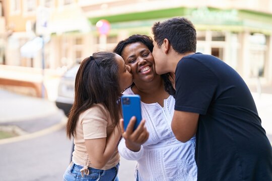 African american family make selfie by smartphone at street