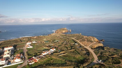 Fototapeta premium Picturesque view of Peniche Portugal, featuring winding roads leading up to a stunning beach