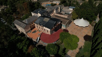 Fototapeta premium Aerial view of a large, three-story country house in Vallfogona, Spain