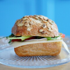 Plate with a wheat sandwich with cheese and ham