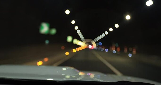 View from car of driving car in a tunnel