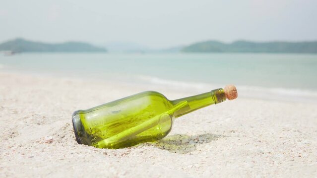 Message in a bottle (MIB) on a sand beach