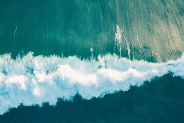 Aerial view of the wild and powerful waves of the sea in Burleigh Heads, Queensland