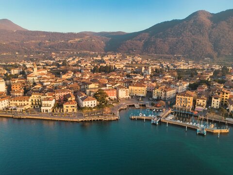 Aerial view of the beautiful Iseo harbor with the city in the background in Italy