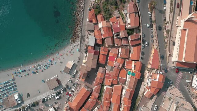 aerial view of the beautiful village of Scilla and Chianalea in Calabria. Note the houses overlooking the sea, the Ruffo castle, the seaside restaurants and the crystal clear Caribbean sea
