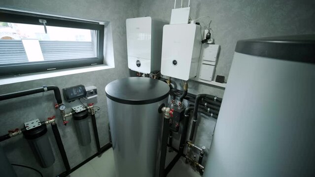 House boiler room interior with modern water heating system