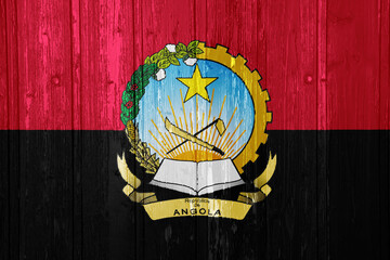 Flag and coat of arms of Republic of Angola on a textured background. Concept collage.