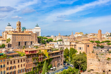 Panoramic cityscape view of the Roman Forum and Roman Altar of the Fatherland in Rome, Italy. World famous landmarks in Italy during summer sunny day