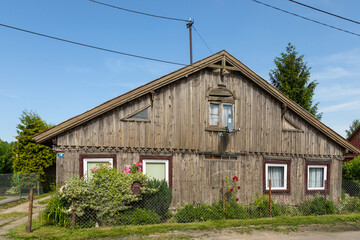 Fototapeta na wymiar Traditional wooden buildings in village of Tujsk. Zulawy, Poland.