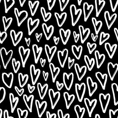 Seamless pattern with abstract white hearts on black background. Hand drawn chalk print for fabric, textiles, wrapping paper. Vector illustration
