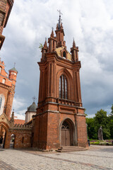 Bell tower of the church of St. Francis of Assisi of the city of Vilnius, in a day with some clouds in the sky.