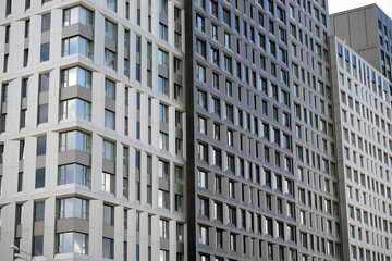 Modern apartment building. Facade with many windows.