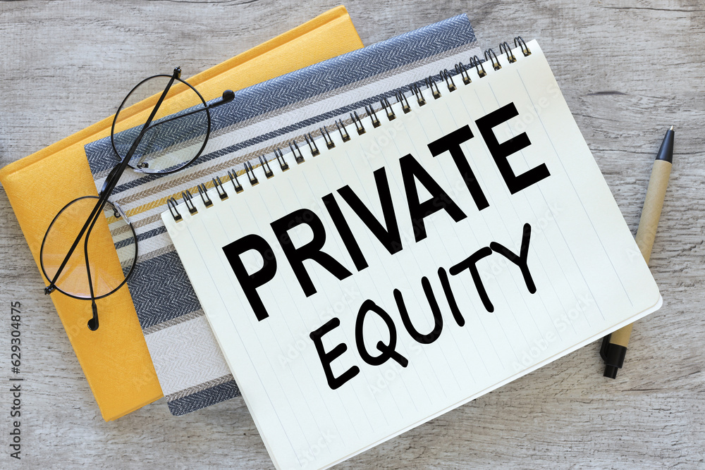 Poster wooden table.yellow notepad and open notebook with text private equity
