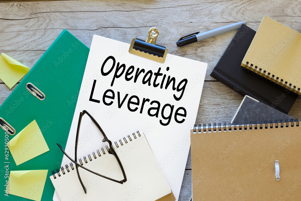 Poster operating leverage. text on white a4 paper. green folder