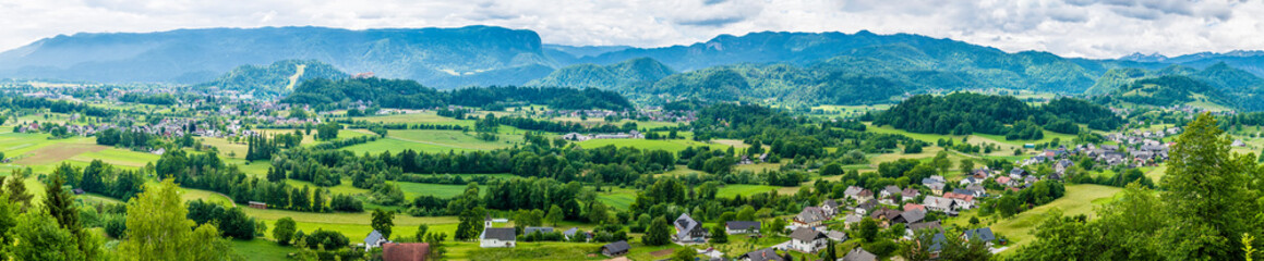 A panorama view across the valley towards the settlements of Spodnje Gorje and Zgornje Gorje near Bled, Slovenia in summertime