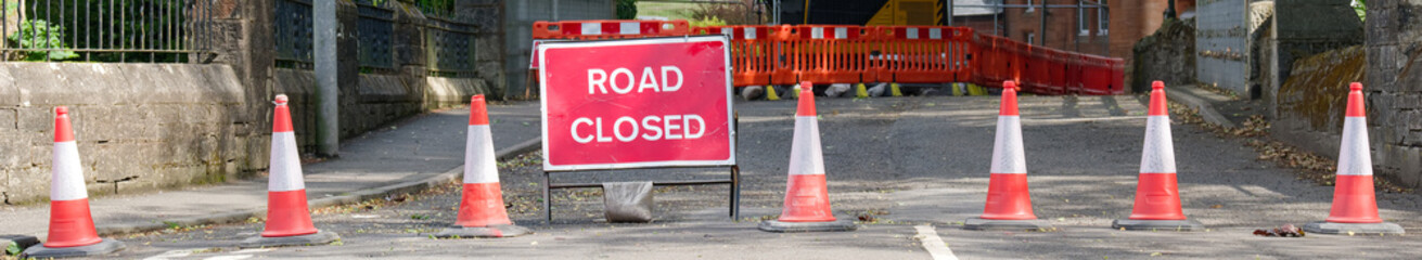 Road ahead closed sign and traffic cones