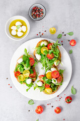 Bruschetta with Cherry Tomatoes, Mini Mozzarella Cheese and Pesto Sauce, Caprese Toasts