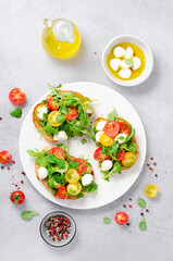 Bruschetta with Cherry Tomatoes, Mini Mozzarella Cheese and Pesto Sauce, Caprese Toasts