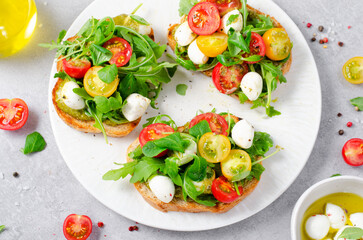 Bruschetta with Cherry Tomatoes, Mini Mozzarella Cheese and Pesto Sauce, Caprese Toasts
