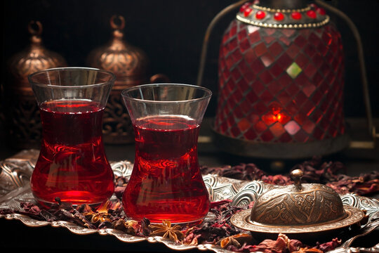 Karkade tea - red tea in Turkish cups on dark background