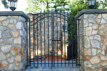 gates guard access, signifying boundaries, protection, and control. Barriers embrace both...