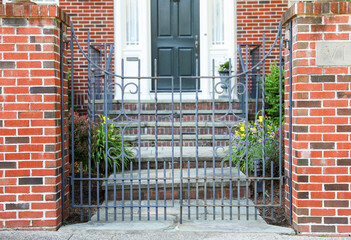 gates guard access, signifying boundaries, protection, and control. Barriers embrace both...
