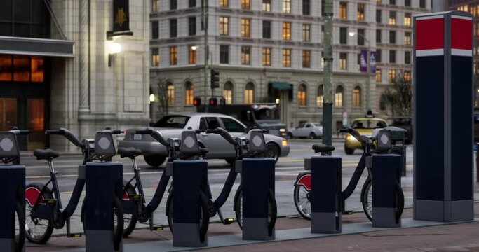 Row of Green bicycles for rent. Electric bicycle charging station. Shared electric bikes parked on city street early in the morning