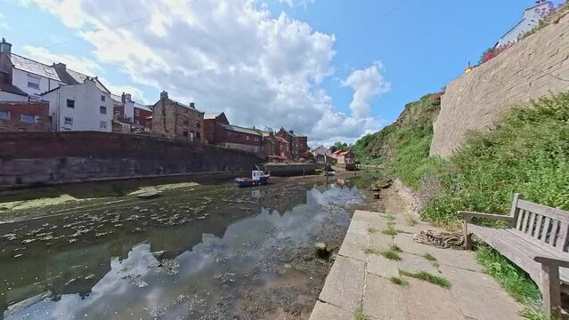 Staithes, North Yorkshire, UK &ndash; June 22 2023. The River Esk in the seaside town of Staithes, North Yorkshire, on a bright and sunny summer day