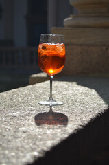 Aperol spritz in a wineglass with shadow