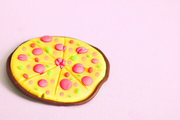 Full pizza on pink background