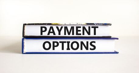 Payment options symbol. Concept words Payment options on beautiful books. Beautiful white table white background. Business payment options concept. Copy space.
