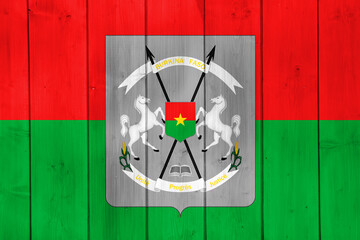 Flag and coat of arms of Burkina Faso on a textured background. Concept collage.