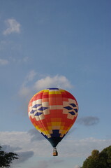 Fototapeta na wymiar Hot air balloon in flight