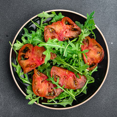tomato arugula salad healthy meal food snack on the table copy space food background rustic top view 
