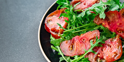 tomato arugula salad healthy meal food snack on the table copy space food background rustic top view 