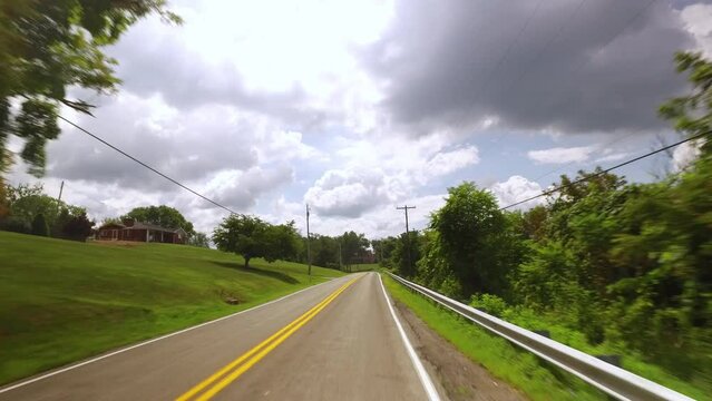 A driver's perspective driving on a Pennsylvania country road outside of Pittsburgh.  	
